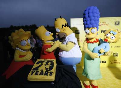 (POGLED) Kolumna Suzana Žilič Fišer: Kot da živimo v Simpsonovih